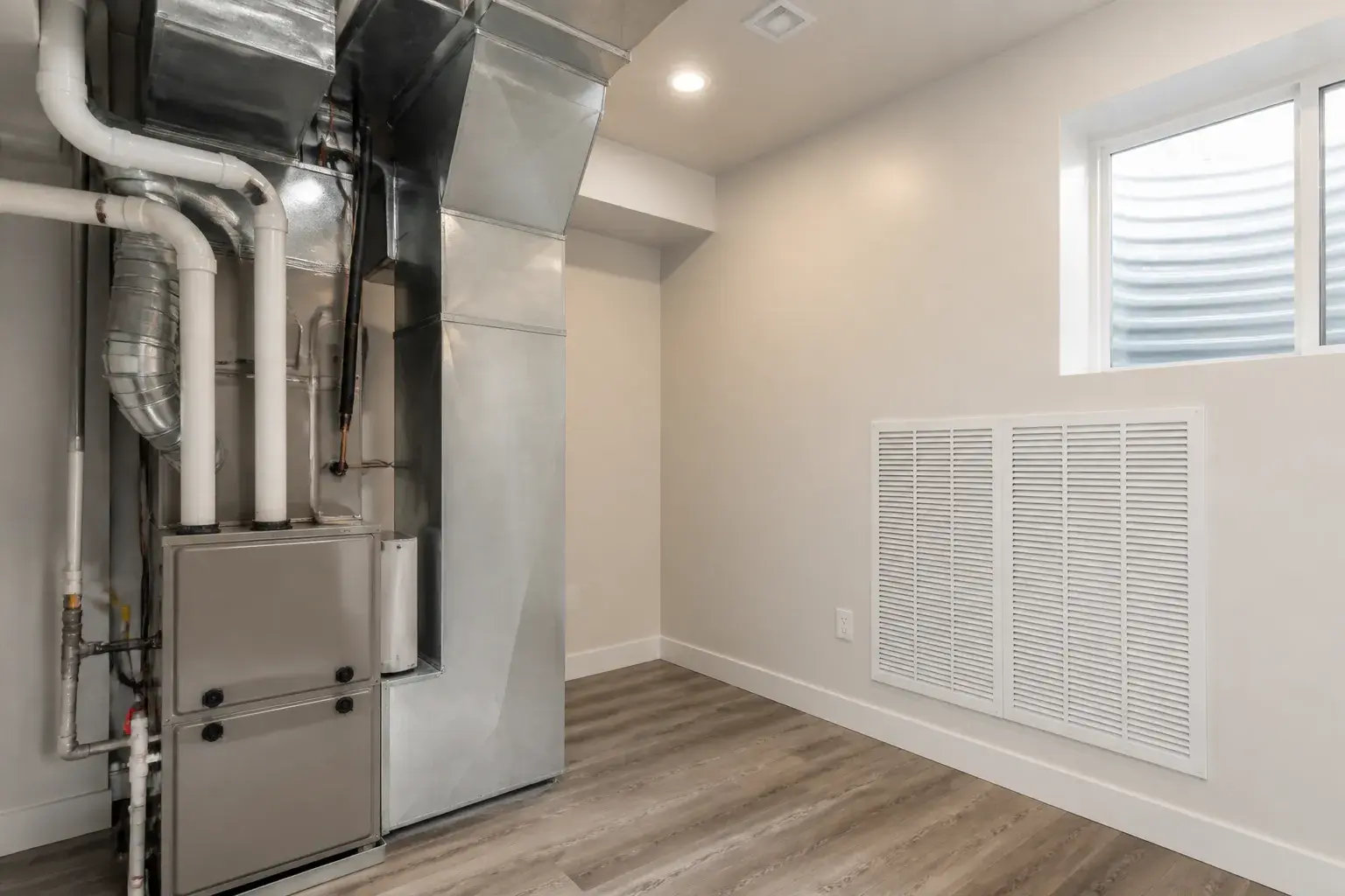 Clean residential mechanical room with new furnace
